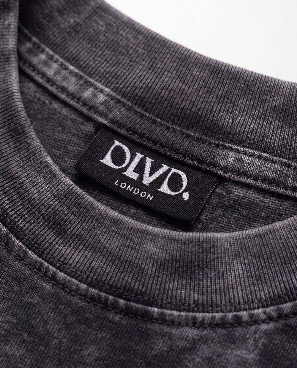 Black DLVD Classic tee side view on model